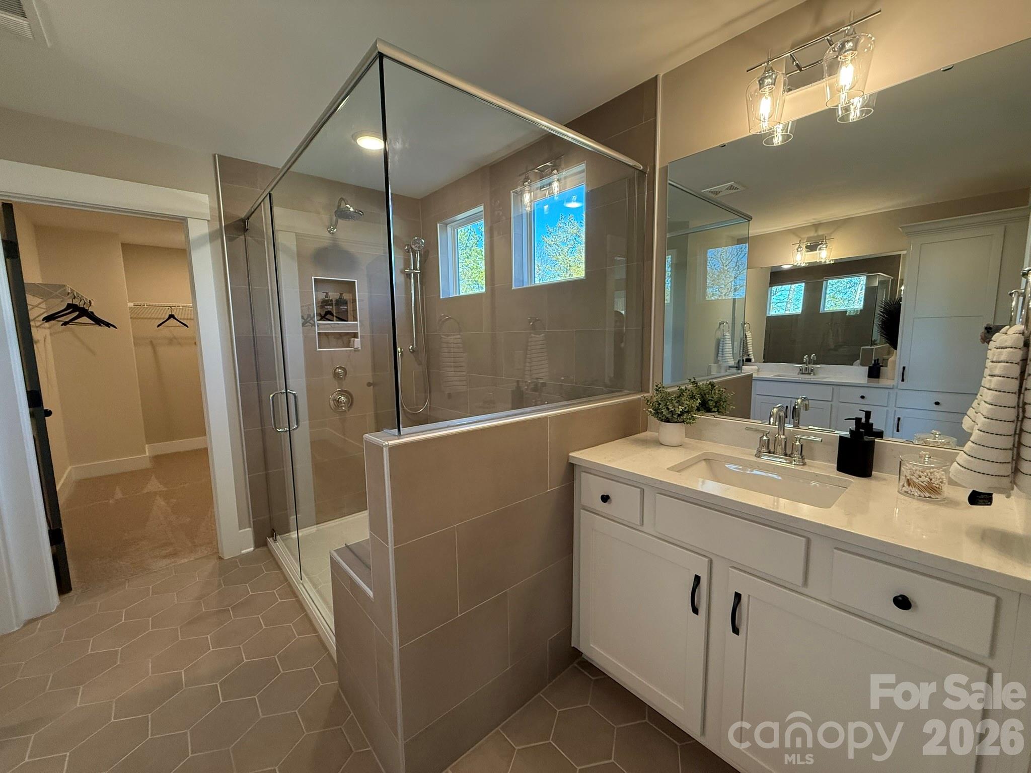 5104 Verona Road Charlotte, NC 28213 - Photo 16 of 28 a bathroom with a double vanity sink mirror and shower