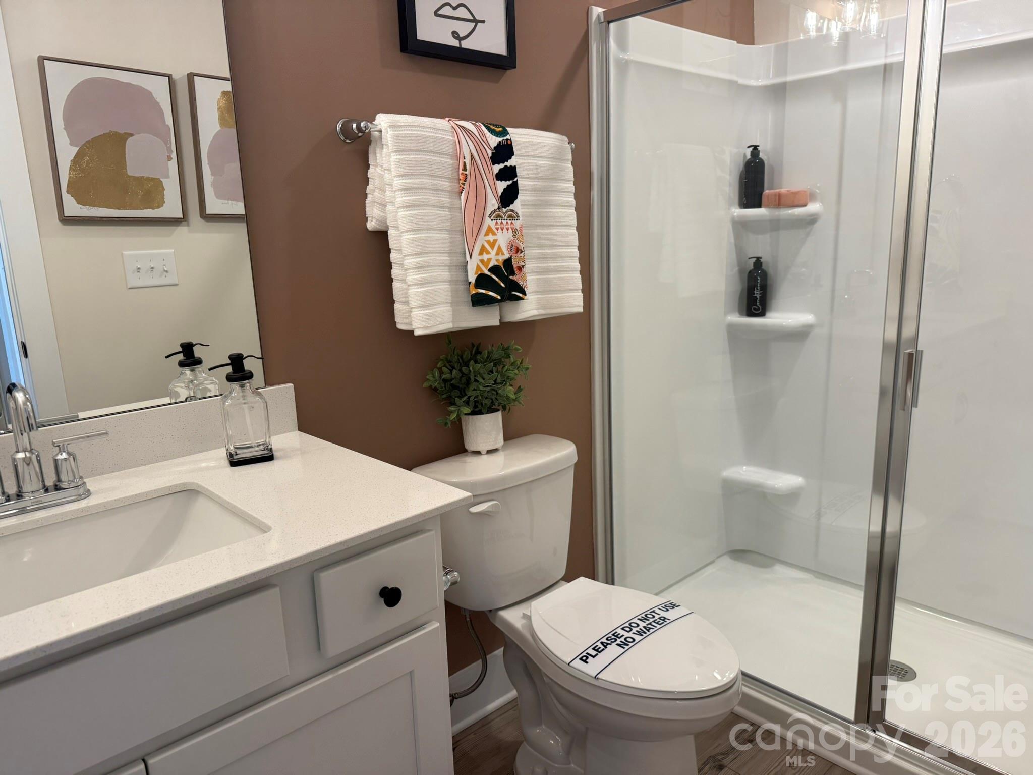 5104 Verona Road Charlotte, NC 28213 - Photo 25 of 28 a bathroom with a sink toilet and mirror