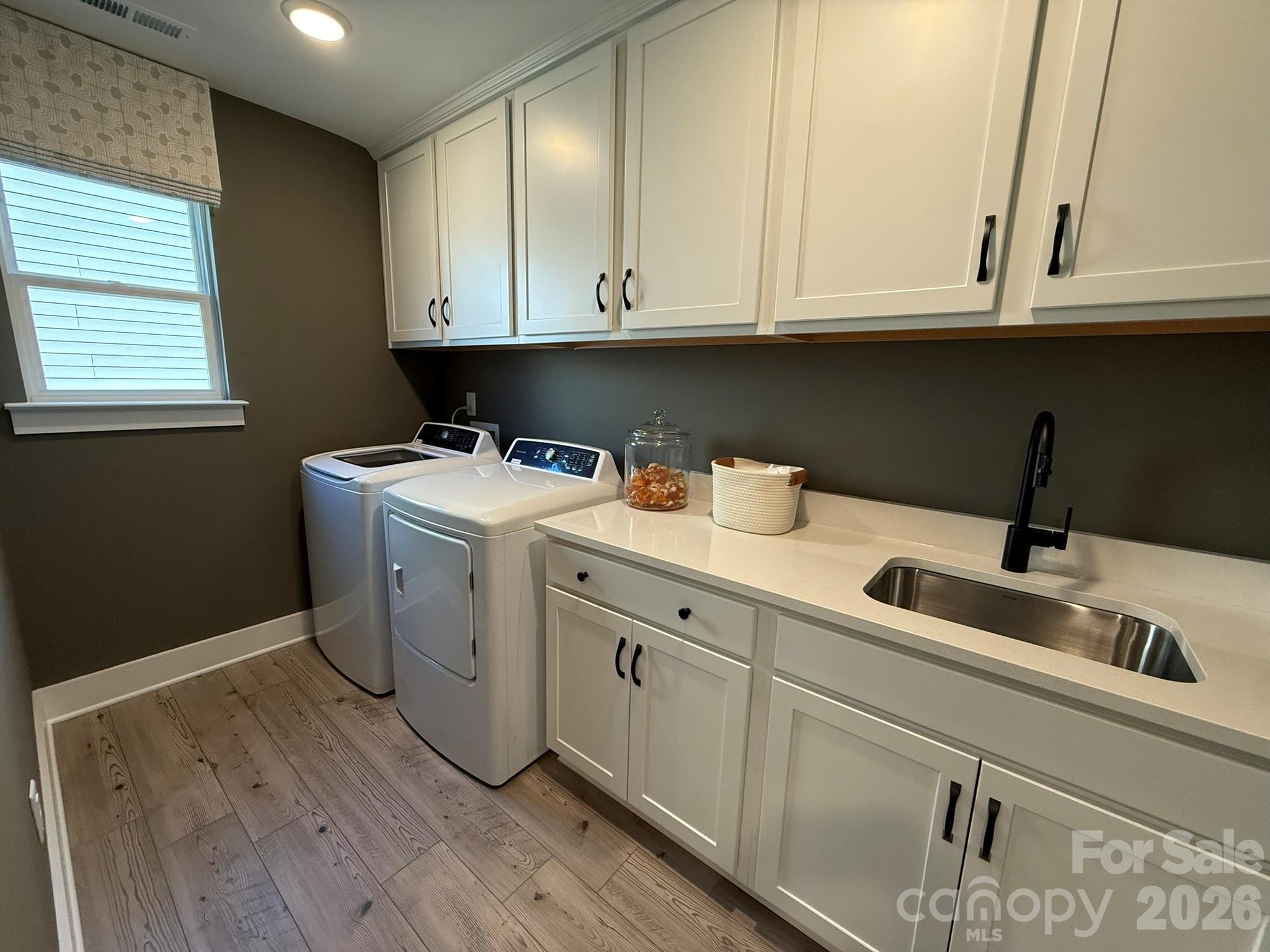 5104 Verona Road Charlotte, NC 28213 - Photo 26 of 28 a utility room with sink dryer and washer