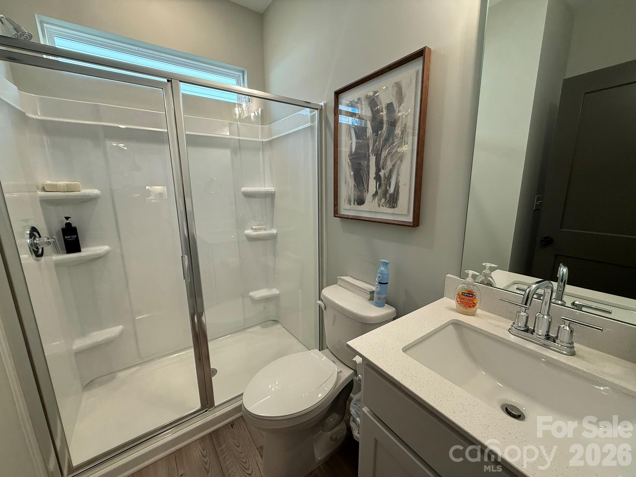 5104 Verona Road Charlotte, NC 28213 - Photo 9 of 28 a bathroom with a sink toilet and shower