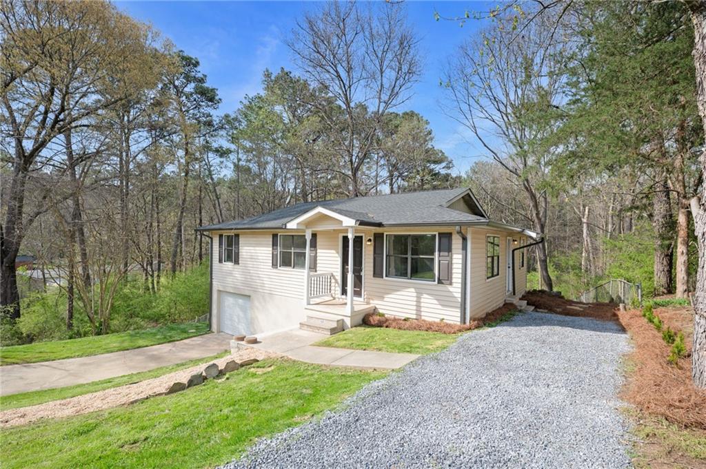 184 Ivey Drive Northwest Calhoun, GA 30701 - Photo 1 of 1 a front view of a house with a yard and trees