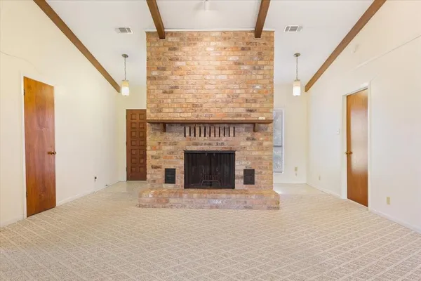 a view of entryway with a fireplace