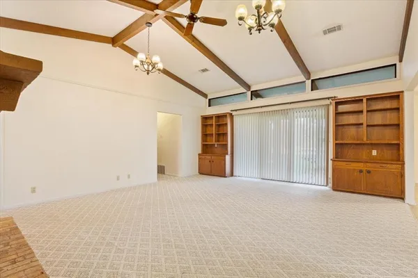 a view of an empty room with a cabinet