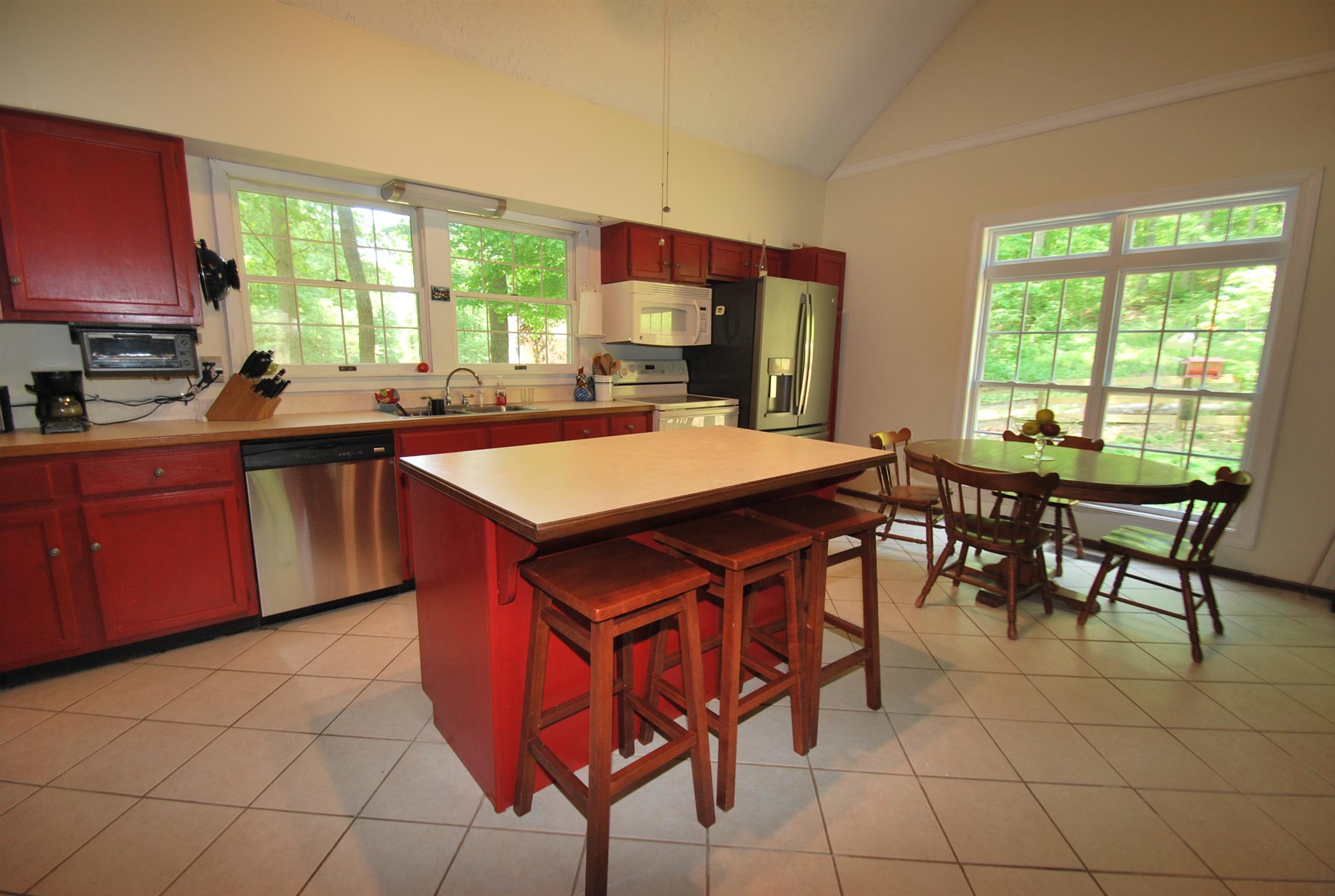 940 North Corinth Road Portland, TN 37148 - Photo 12 of 30 a kitchen with stainless steel appliances a sink a counter top space and a window