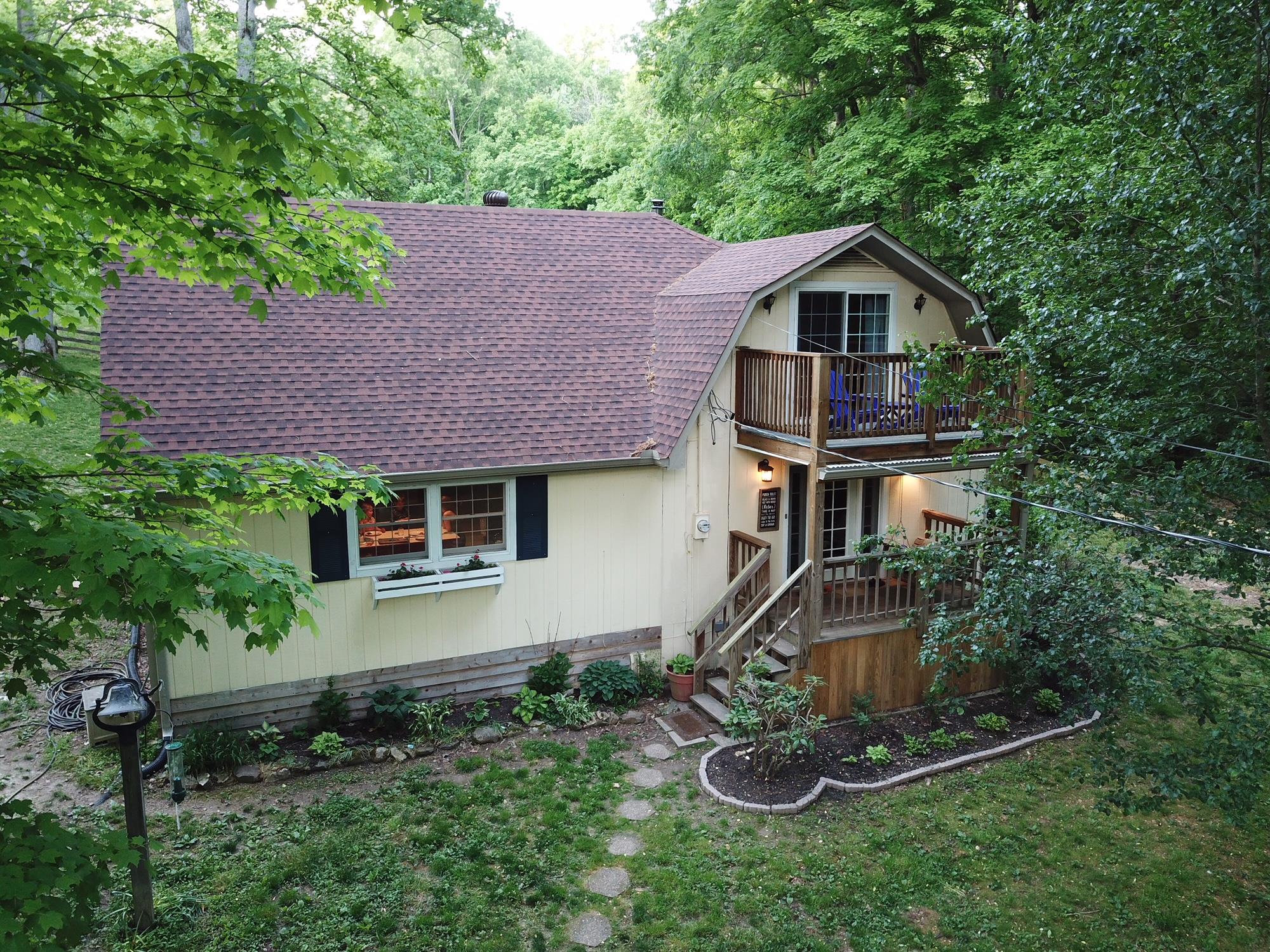 940 North Corinth Road Portland, TN 37148 - Photo 3 of 30 a aerial view of a house with a yard and potted plants