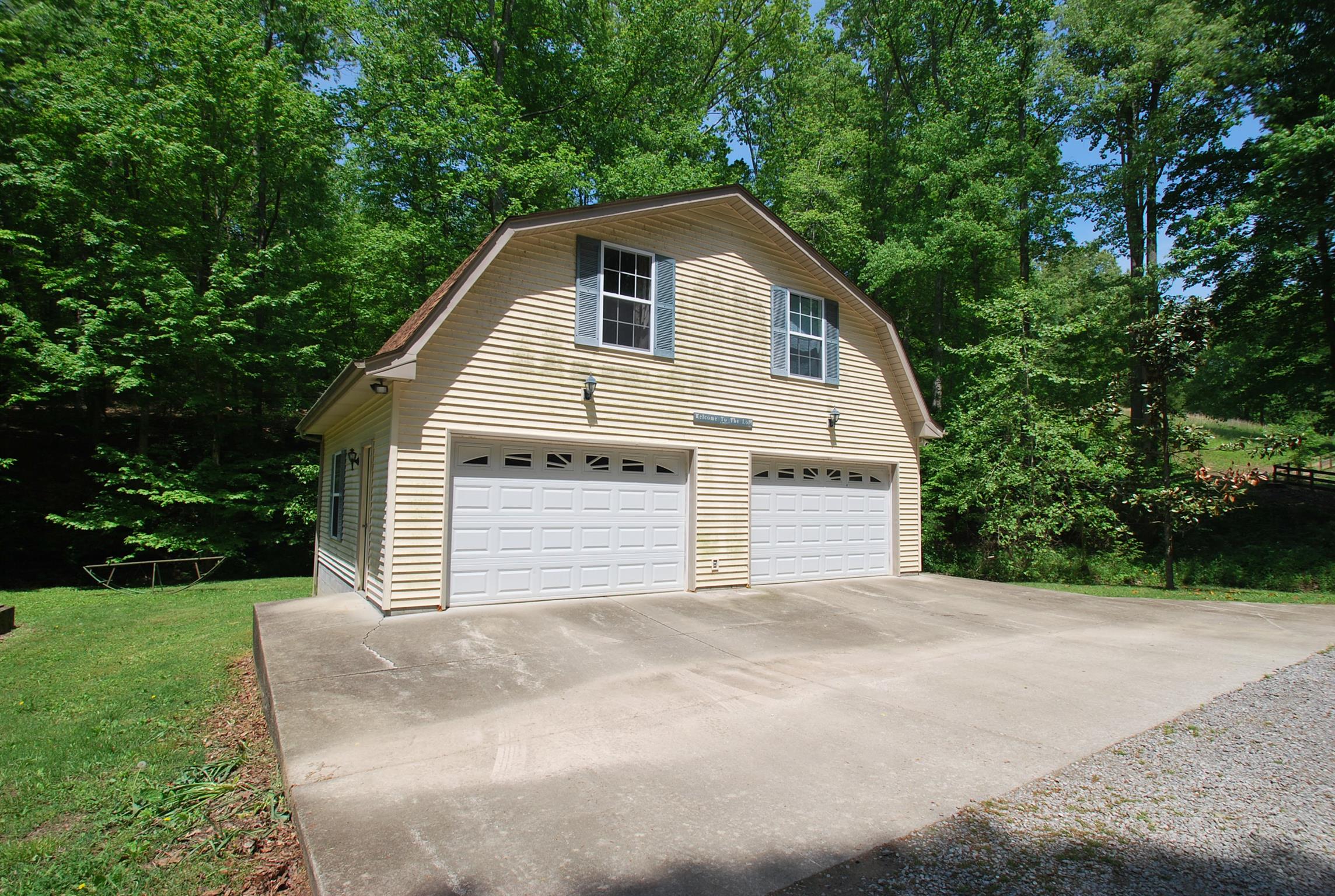 940 North Corinth Road Portland, TN 37148 - Photo 6 of 30 a view of a house with a yard and garage