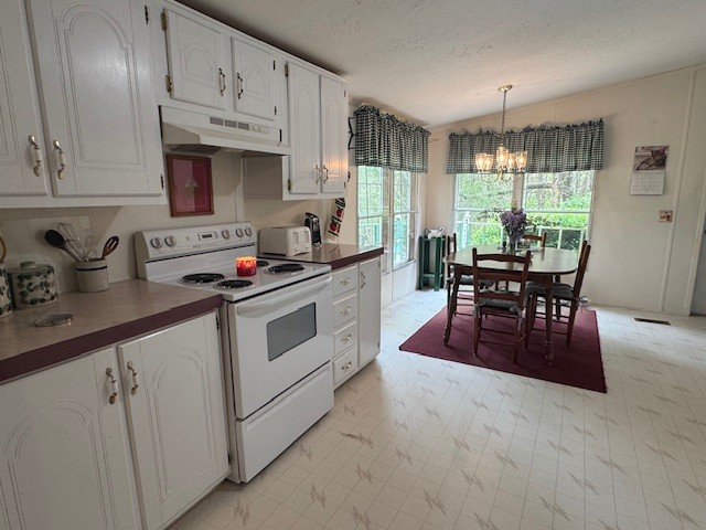 9088 Buck Litton Road Lyles, TN 37098 - Photo 24 of 69 a kitchen with stainless steel appliances granite countertop a stove a sink dishwasher a microwave oven and white cabinets with wooden floor
