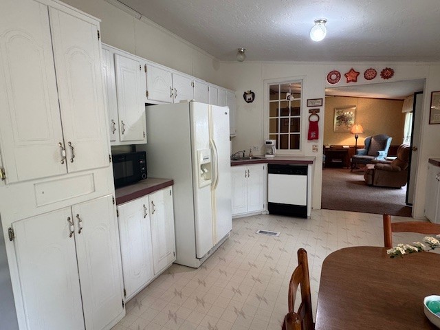 9088 Buck Litton Road Lyles, TN 37098 - Photo 28 of 69 a kitchen with stainless steel appliances a refrigerator and a stove top oven