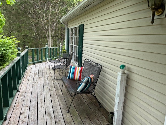 9088 Buck Litton Road Lyles, TN 37098 - Photo 37 of 69 a view of balcony with wooden floor and outdoor seating