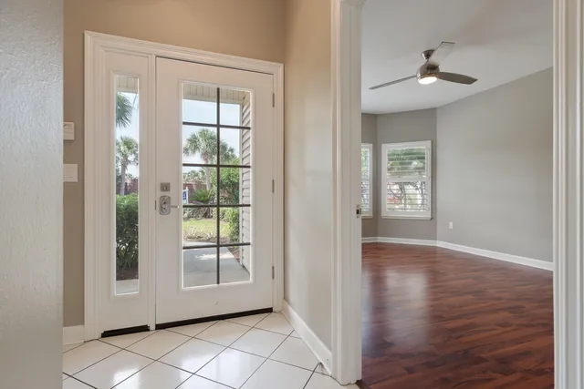 a spacious bathroom with a double vanity sink a toilet and a mirror