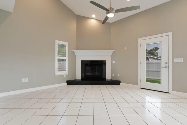 a kitchen with microwave a stove and cabinets