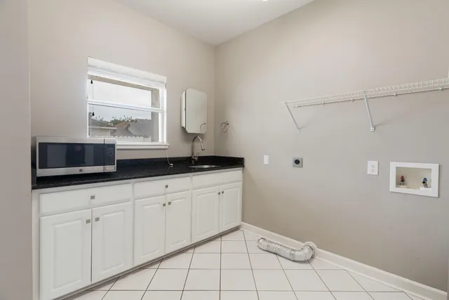 a view of a hallway with wooden floor and entryway