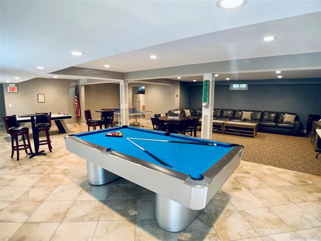 a room with furniture pool table and a table