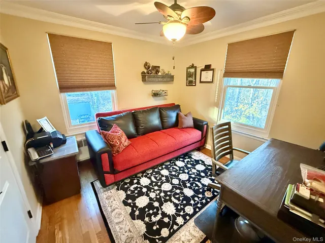 a living room with furniture and a window