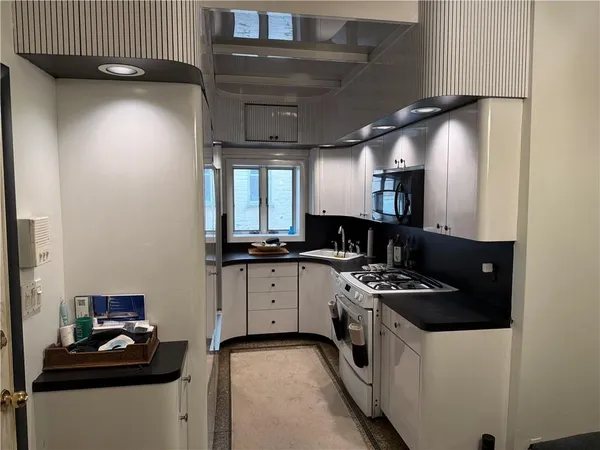 a kitchen with a sink and cabinets