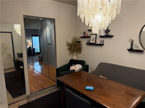 a living room with table and chairs