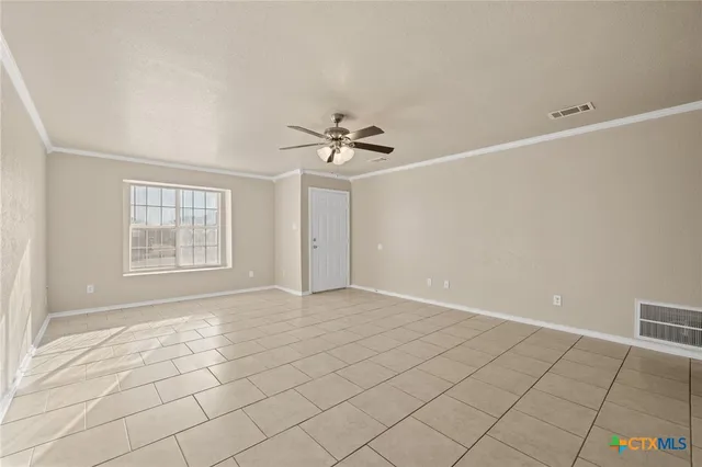 a view of an empty room with a window
