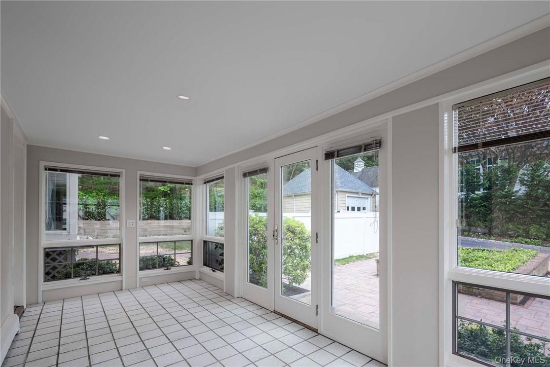 62 Summit Avenue Bronxville, NY 10708 - Photo 14 of 24 Glass enclosed Heated Porch with doors to Living Room and to the Outside