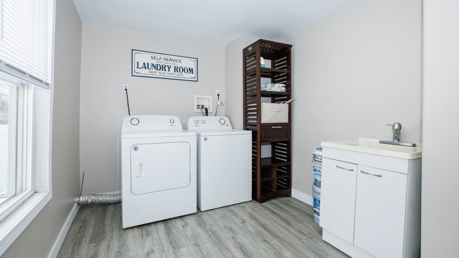 300 East South Street Atlanta, IL 61723 - Photo 19 of 69 a utility room with cabinets dryer and washer