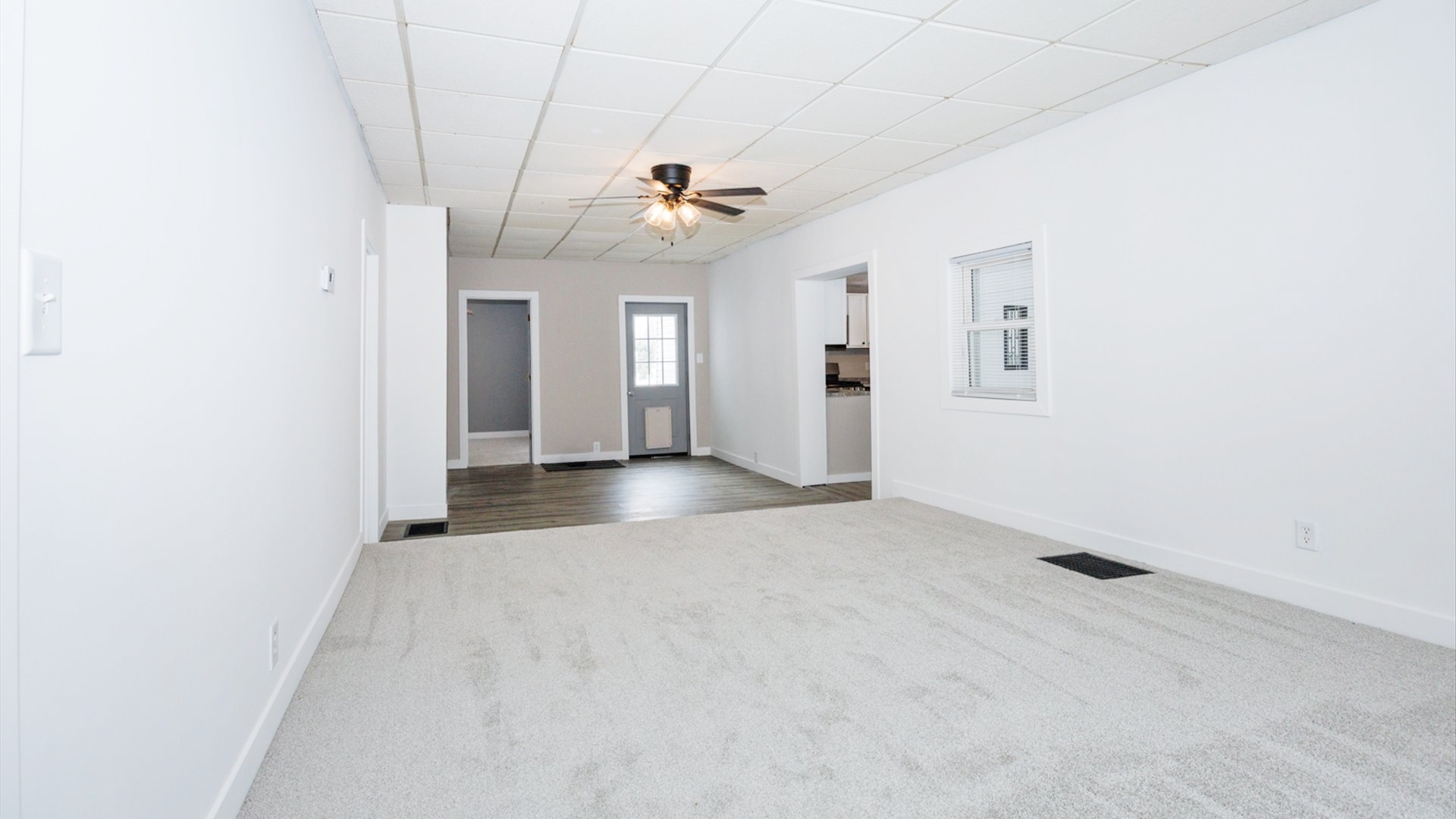 300 East South Street Atlanta, IL 61723 - Photo 20 of 69 an empty room with windows and fan