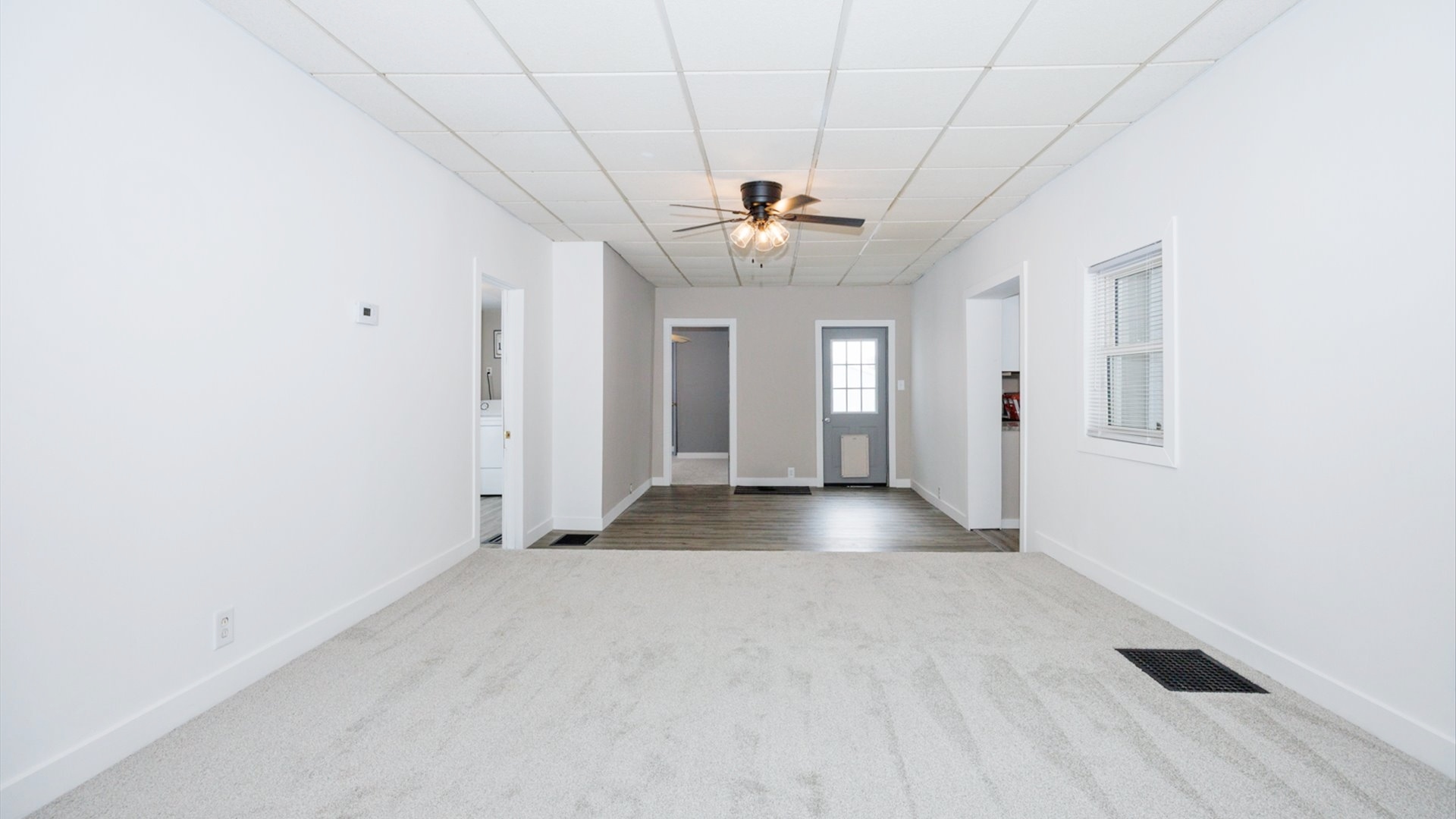 300 East South Street Atlanta, IL 61723 - Photo 24 of 69 wooden floor in an empty room with a window