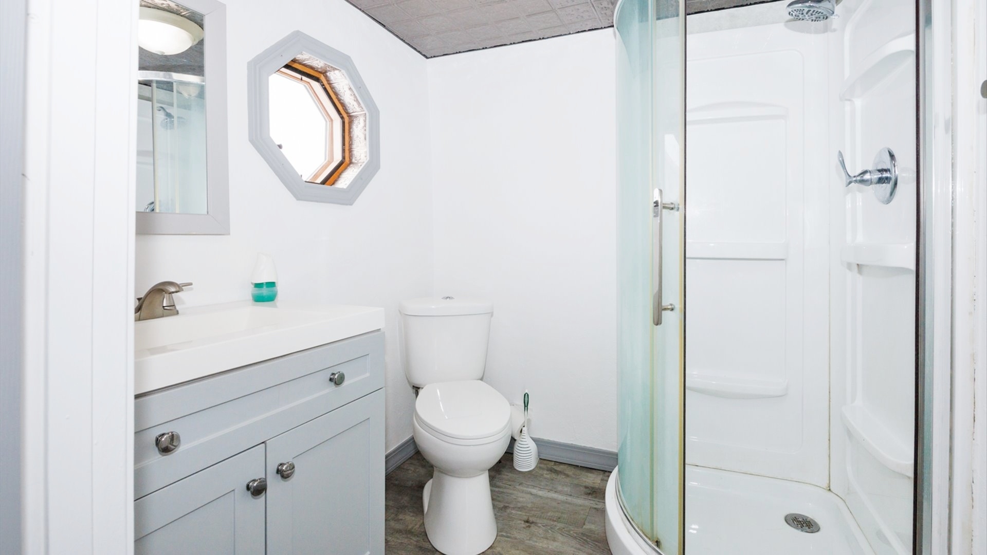 300 East South Street Atlanta, IL 61723 - Photo 30 of 69 a bathroom with a sink and a mirror
