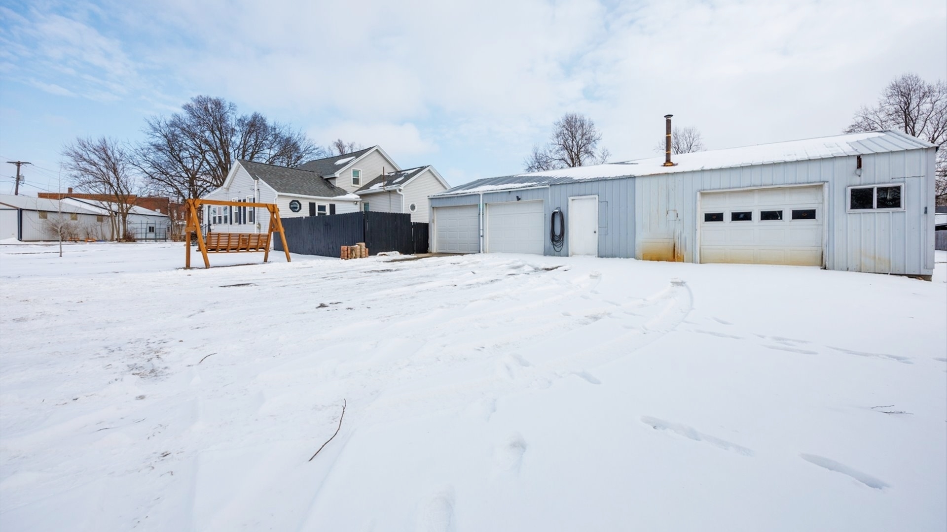 300 East South Street Atlanta, IL 61723 - Photo 46 of 69 a view of a house with a snow in the yard