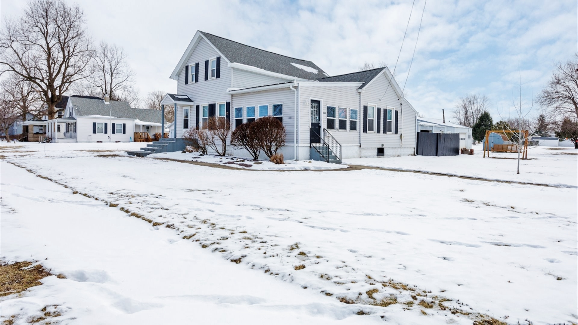 300 East South Street Atlanta, IL 61723 - Photo 61 of 69 a view of a house with snow on the road