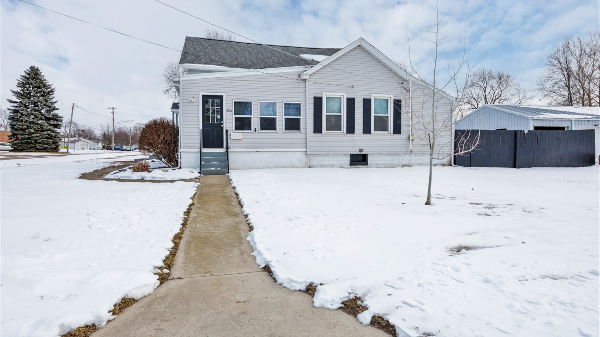 300 East South Street Atlanta, IL 61723 - Photo 62 of 69 a view of a house with snow on the road