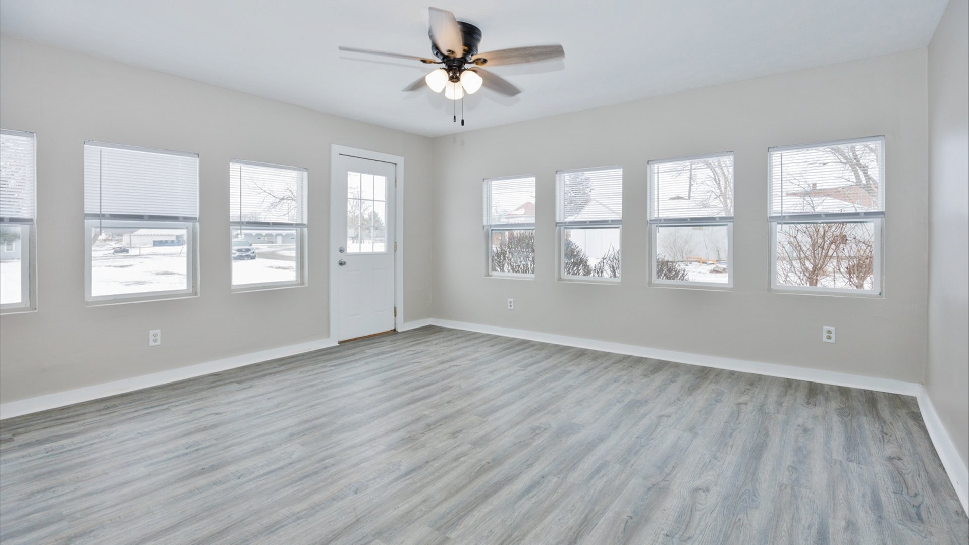 300 East South Street Atlanta, IL 61723 - Photo 7 of 69 a view of an empty room with wooden floor and a window