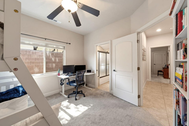 1609 East 10 S Street St. George, UT 84790 - Photo 36 of 68 Carpeted room featuring a ceiling fan with light fixture, window with blinds, and built-in shelving