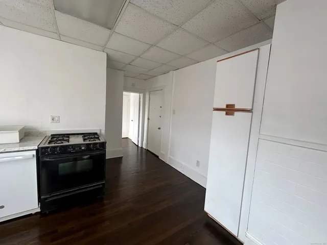 a kitchen with a stove and a refrigerator
