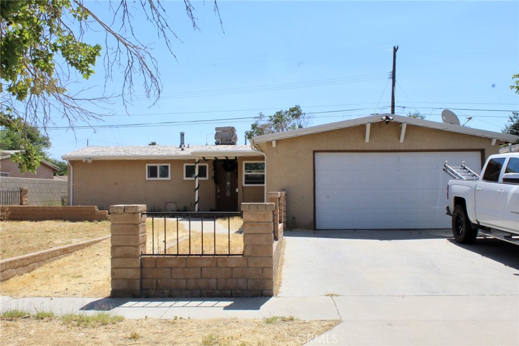 44008 2nd Street East Lancaster, CA 93535 - Photo 1 of 1 a front view of a house with a yard