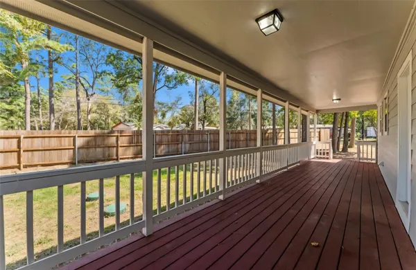 a view of a porch with wooden floor
