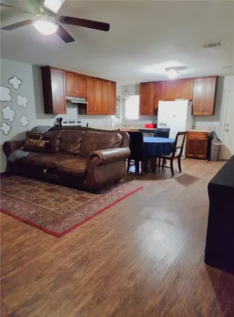 a large kitchen with a table and chairs