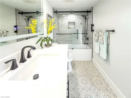 a balcony view with a sink and glass windows