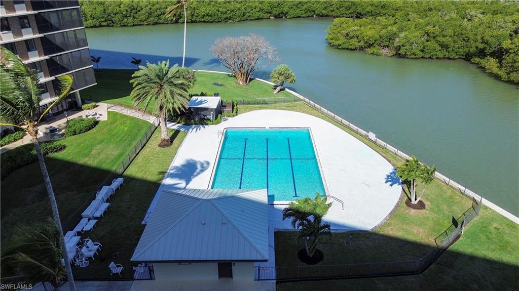 17 Bluebill Avenue, Unit 206 Naples, FL 34108 - Photo 32 of 44 swimming pool view with a lake view