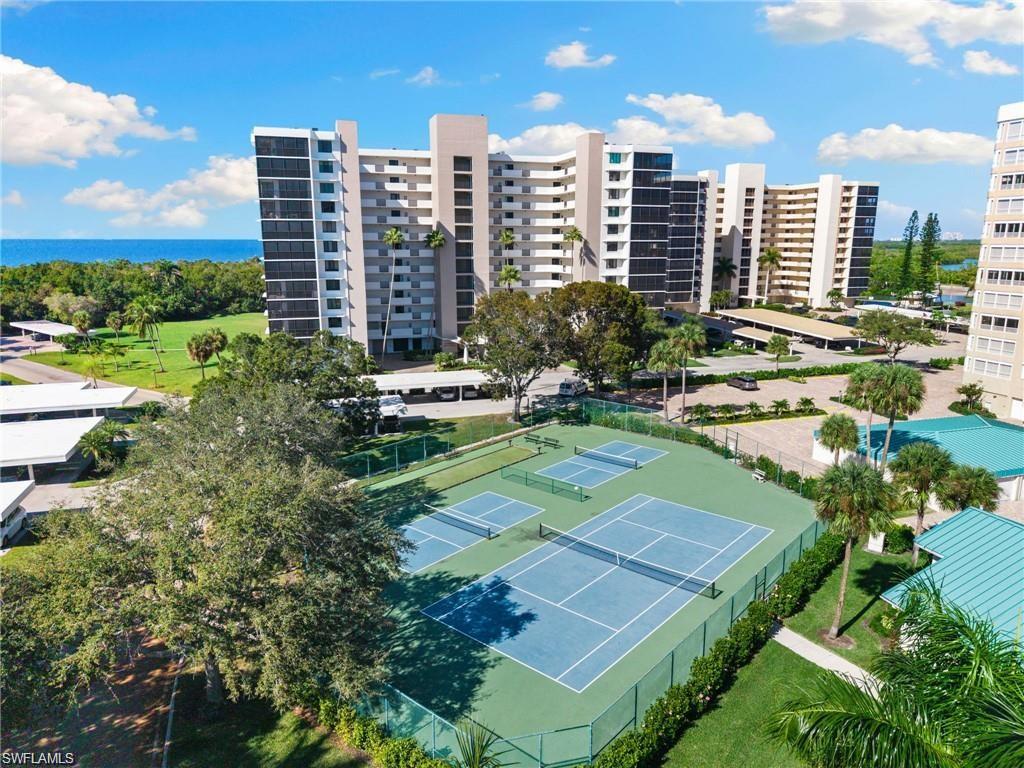 17 Bluebill Avenue, Unit 206 Naples, FL 34108 - Photo 35 of 44 a view of a city with tall buildings