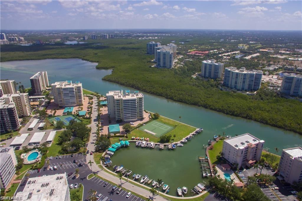 17 Bluebill Avenue, Unit 206 Naples, FL 34108 - Photo 41 of 44 an aerial view of a city with lots of residential buildings lake and ocean view