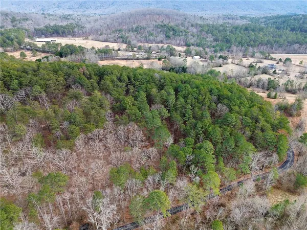 an aerial view of a house with mountain view