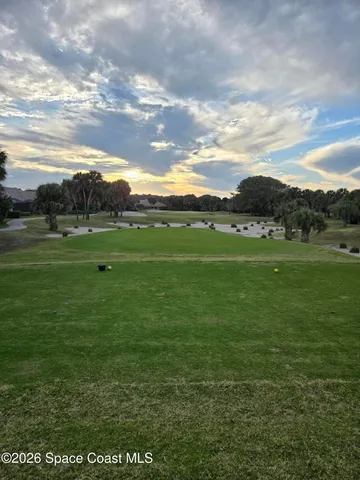 a view of field with grassy field