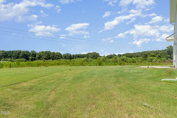 a view of an ocean and a yard