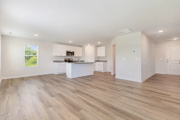 a view of kitchen with wooden floor
