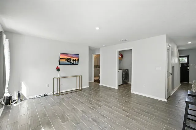 a view of a livingroom with wooden floor