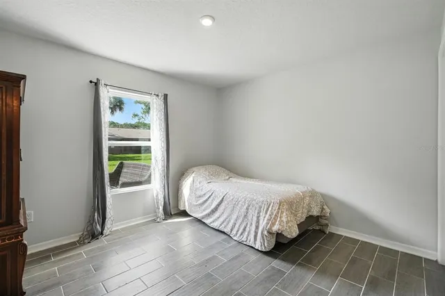 a room with a bed and a window