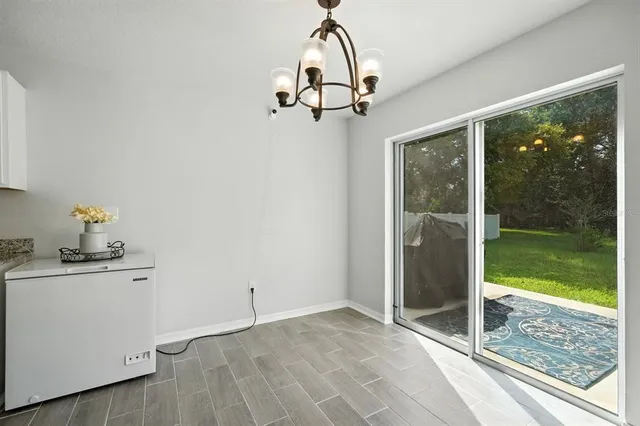 a view of a room with sliding door and wooden floor