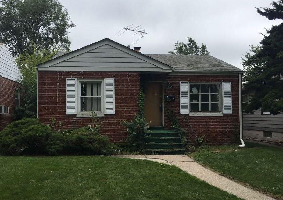 3666 Johnson Street Gary, IN 46408 - Photo 1 of 1 a front view of a house with a yard