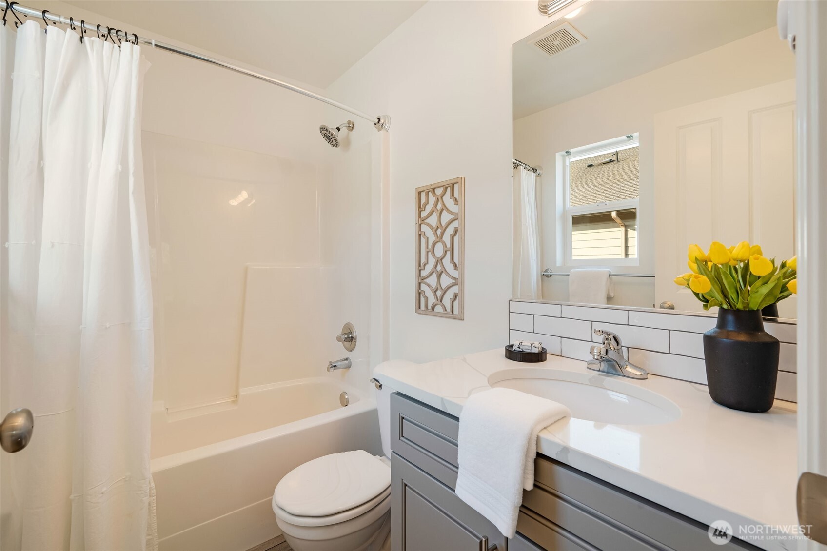 4678 Wade Street, Unit 201 Bellingham, WA 98226 - Photo 21 of 25 a bathroom with a granite countertop sink a toilet and shower