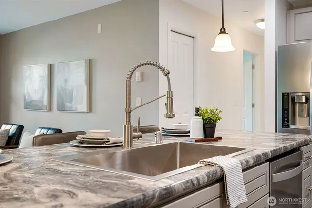 a living room with granite countertop furniture and a mirror
