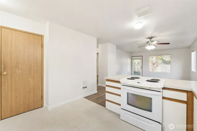 a kitchen with a stove and a microwave